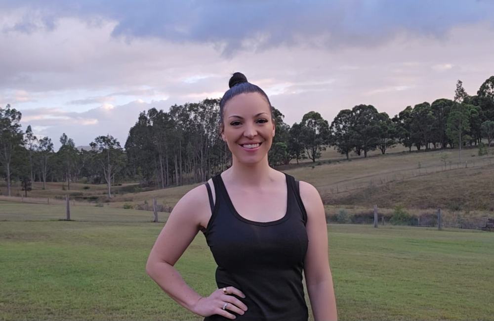 Maree Stuart, in-home personal trainer in the Hunter Valley, in a paddock at dusk